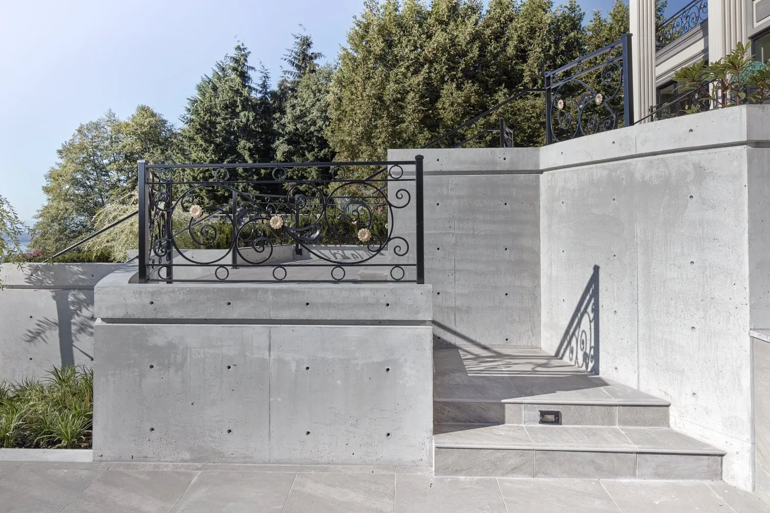 Clean-line concrete stairs at a home entrance, British Properties