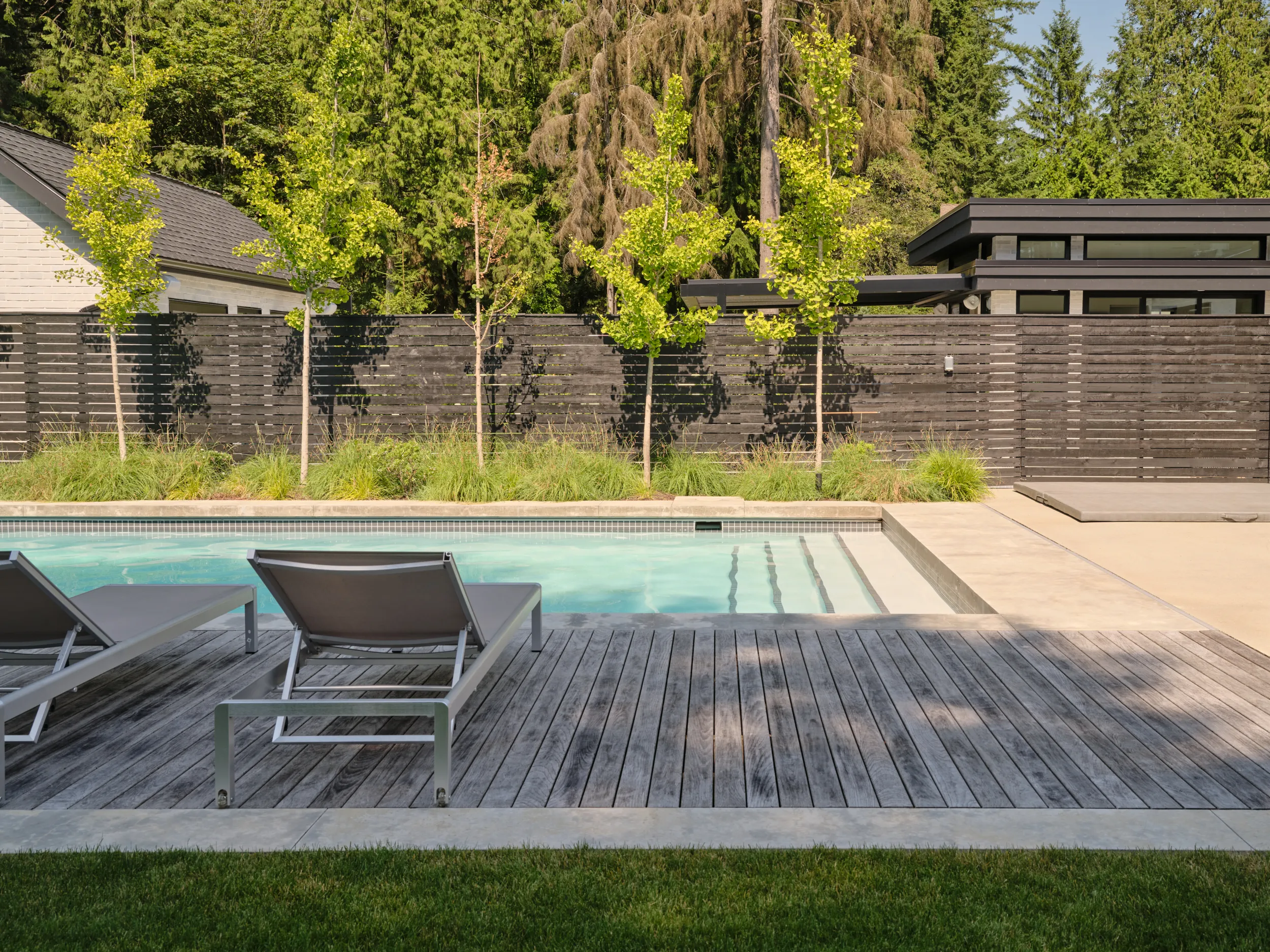 Concrete pool house and outdoor shower, Capilano project, North Vancouver