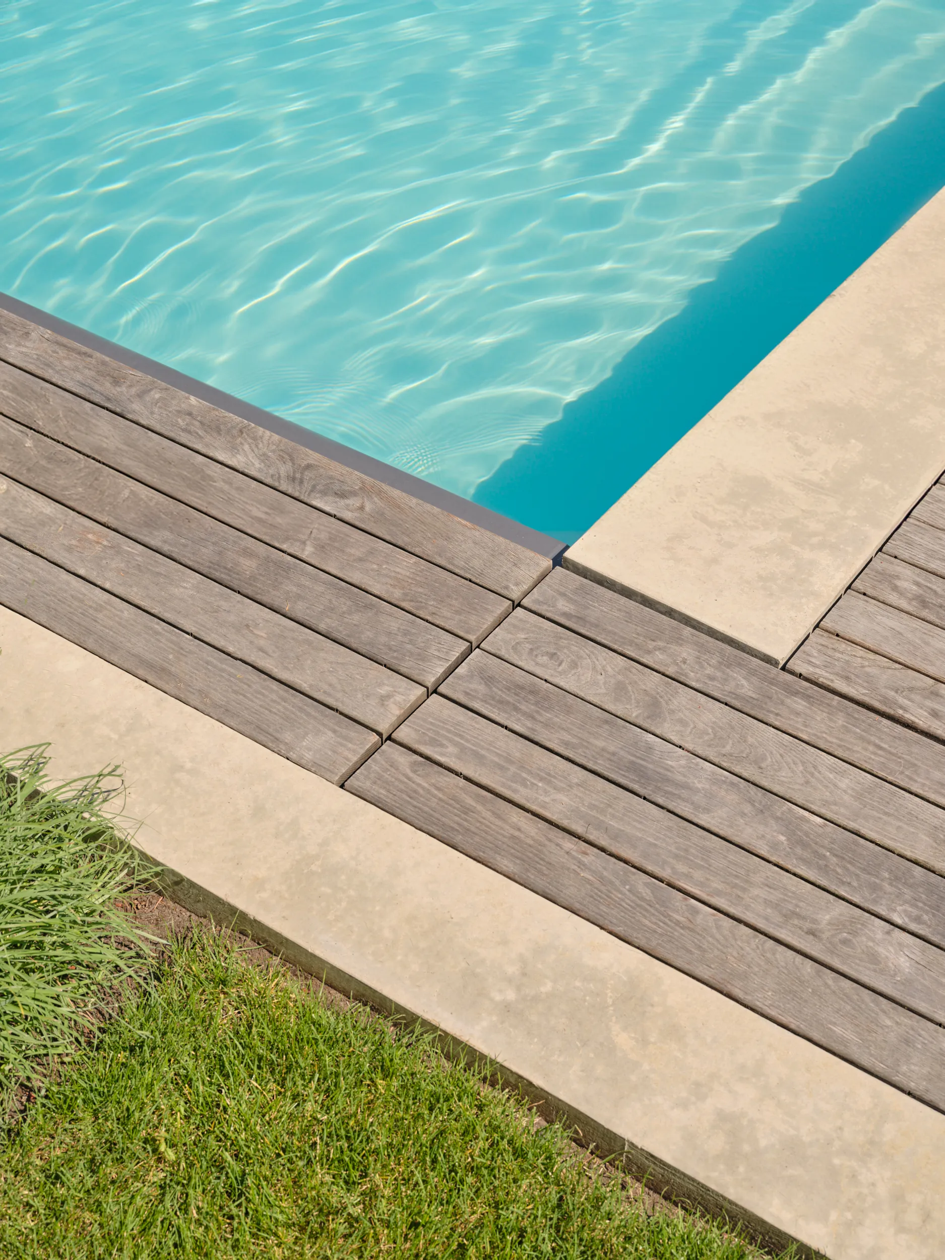 Thermally-treated decking beside the concrete pool house, Capilano