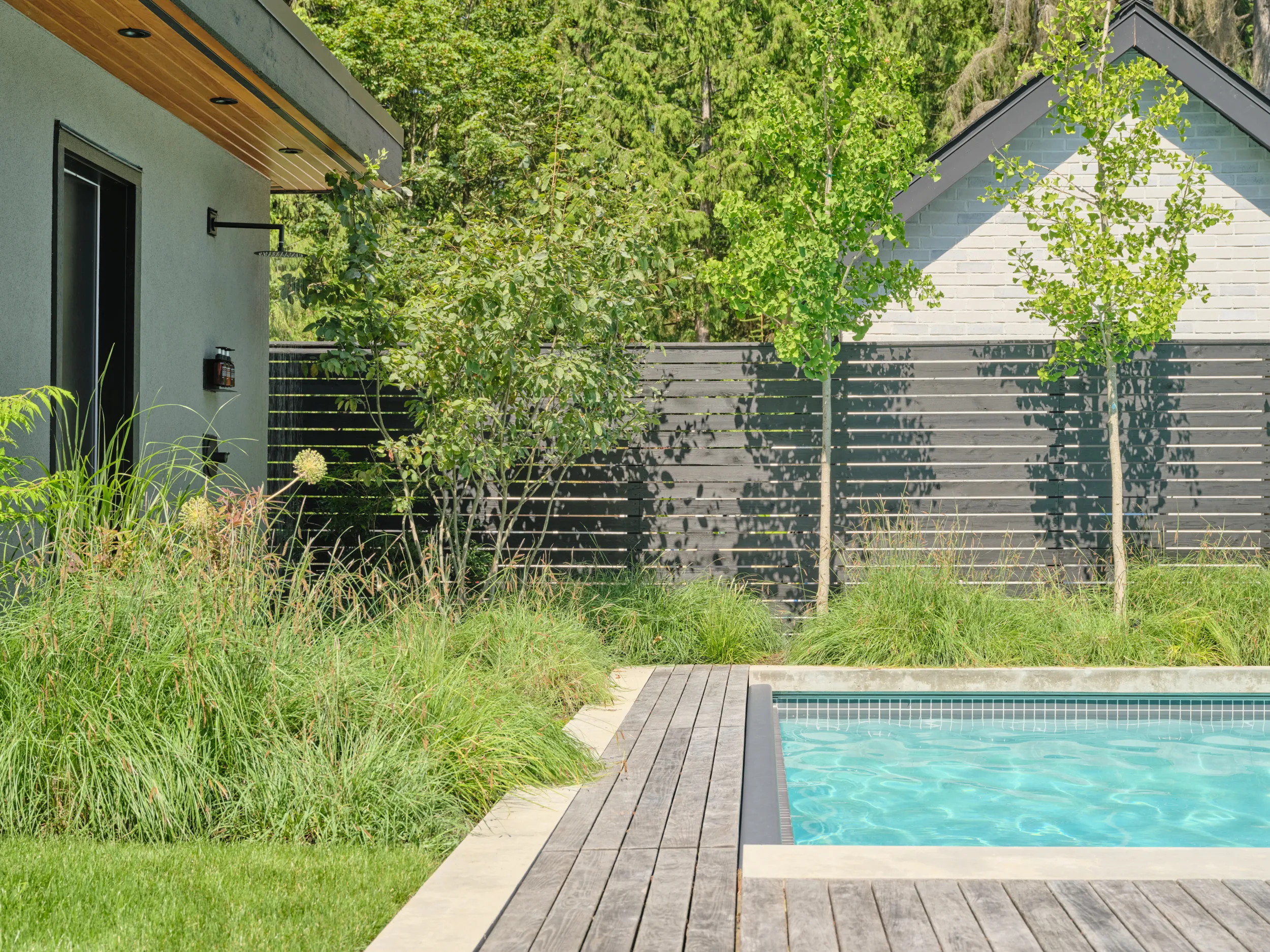 Outdoor shower set into the concrete pool house wall, Capilano, North Vancouver